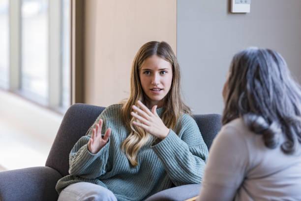 A counselor in conversation with a client during a supportive session